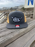 ShredDelish Shaka Charcoal & Old Gold 7 Panel Trucker Cap